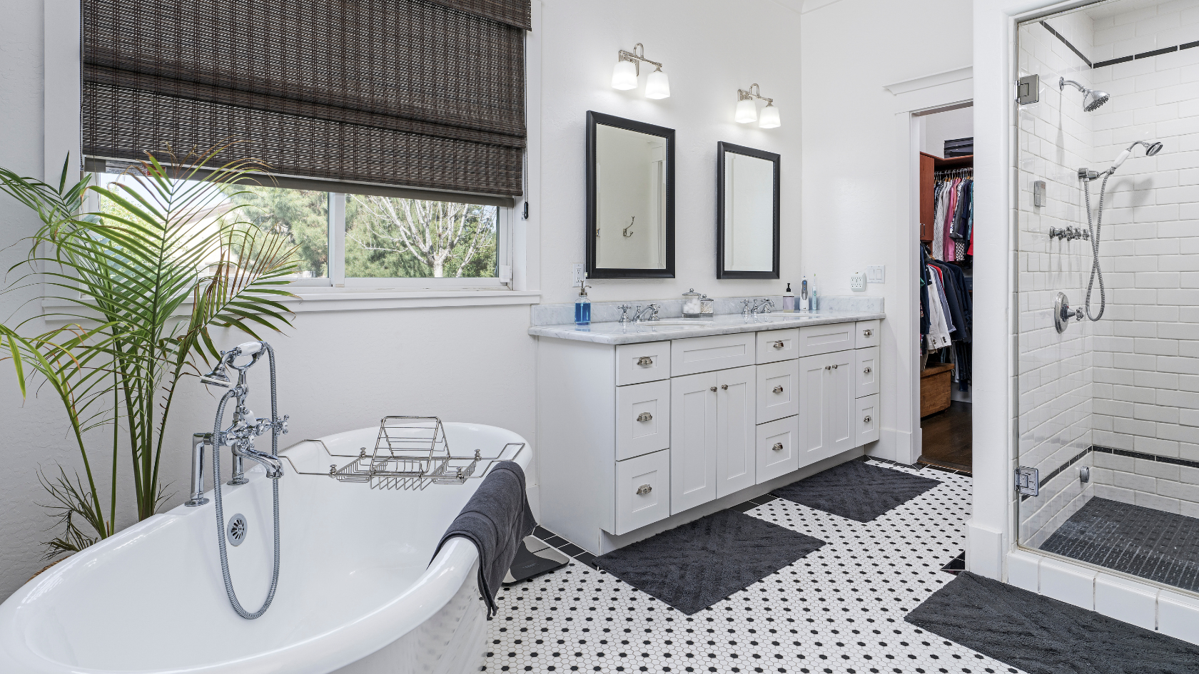 A white bathroom with a black and white checkered floor