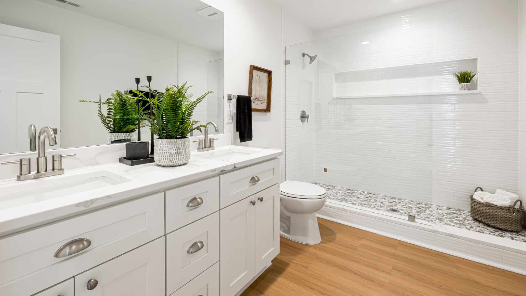 A bathroom with a toilet, sink, and shower